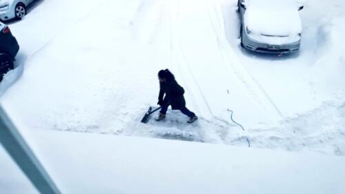 Wife Shoveling Snow